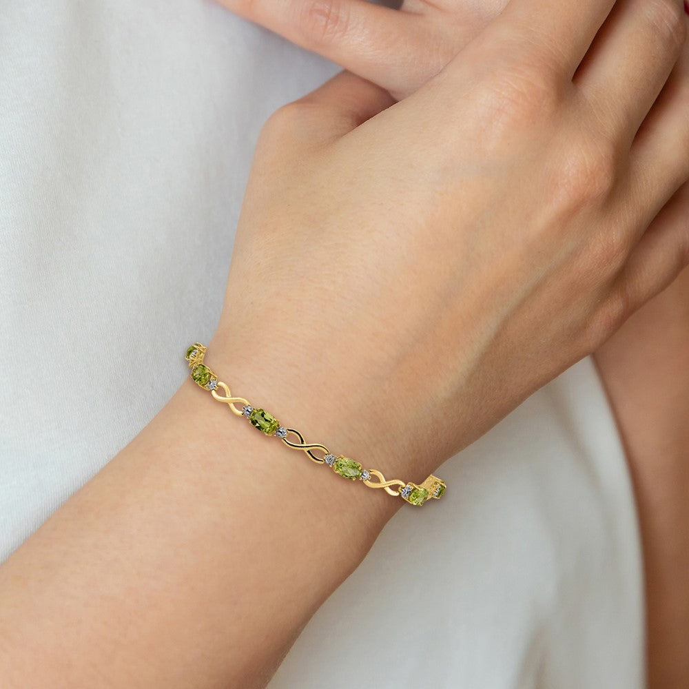 14k Complete Oval Peridot and Diamond Infinity Link 7 inch Bracelet (4.65 grams)