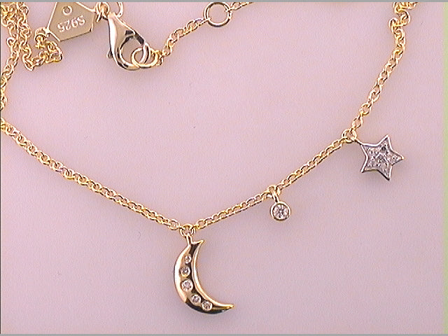 Sterling Silver 1/10Ctw-Dia Cn Star And Moon Bracelet (2.07 grams)