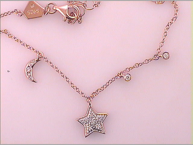 Sterling Silver 1/10Ctw-Dia Cn Star And Moon Bracelet (2.07 grams)